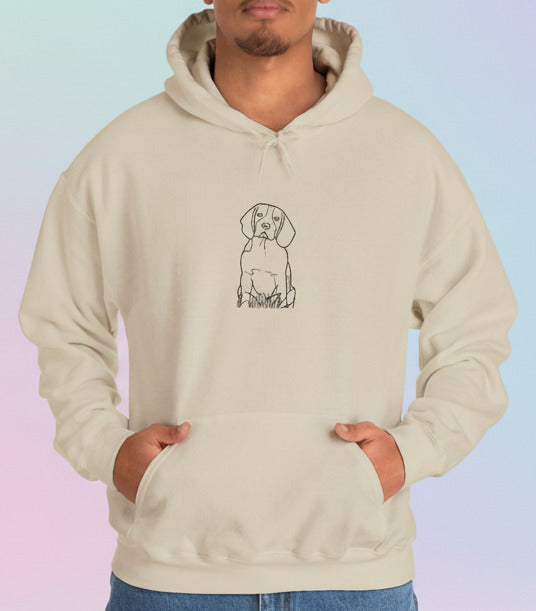 a baby blue hoodie with a dog illustration worn by a man on a pastel background