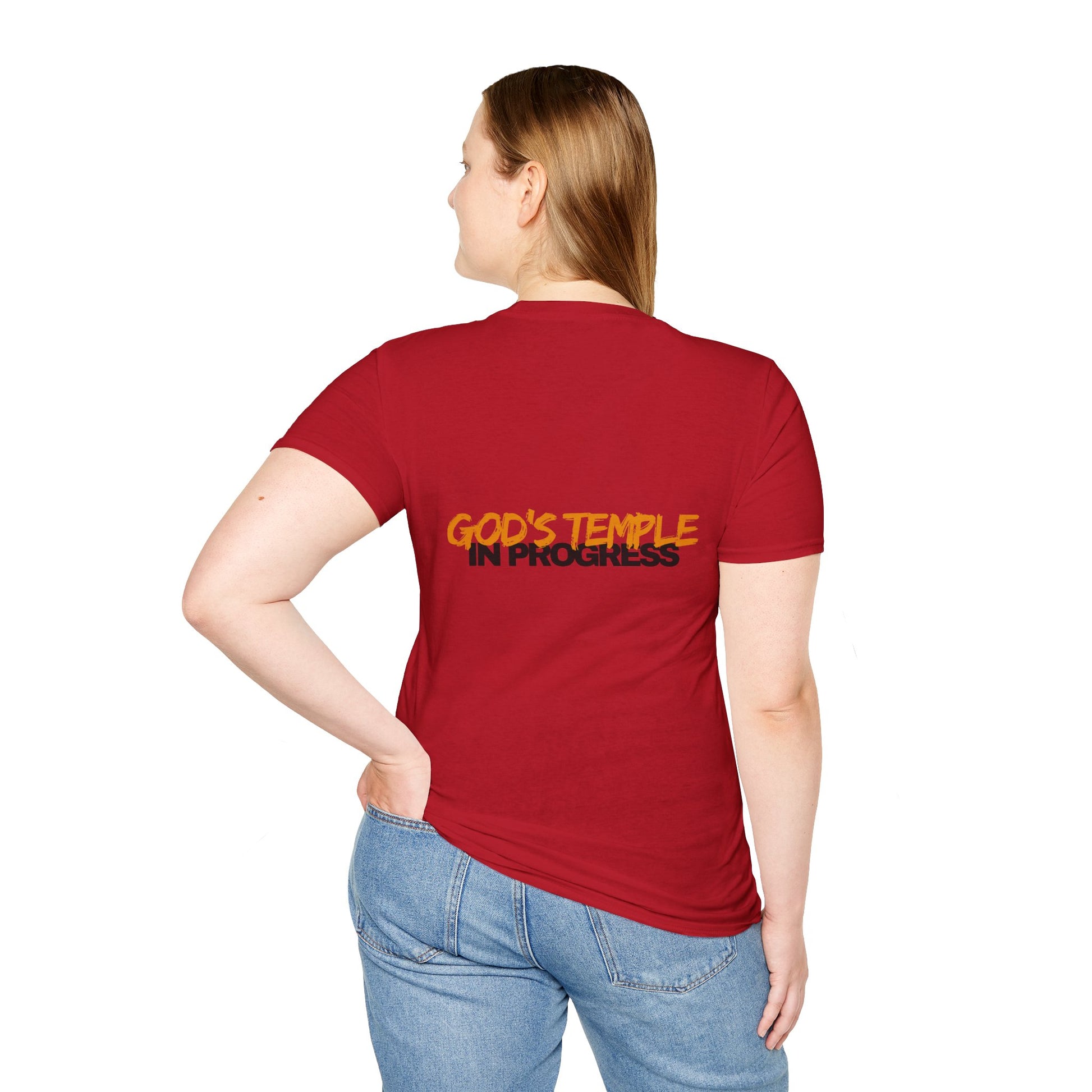 Person wearing a red t-shirt with 'God's Temple in Progress' text on the back, standing against a white background.