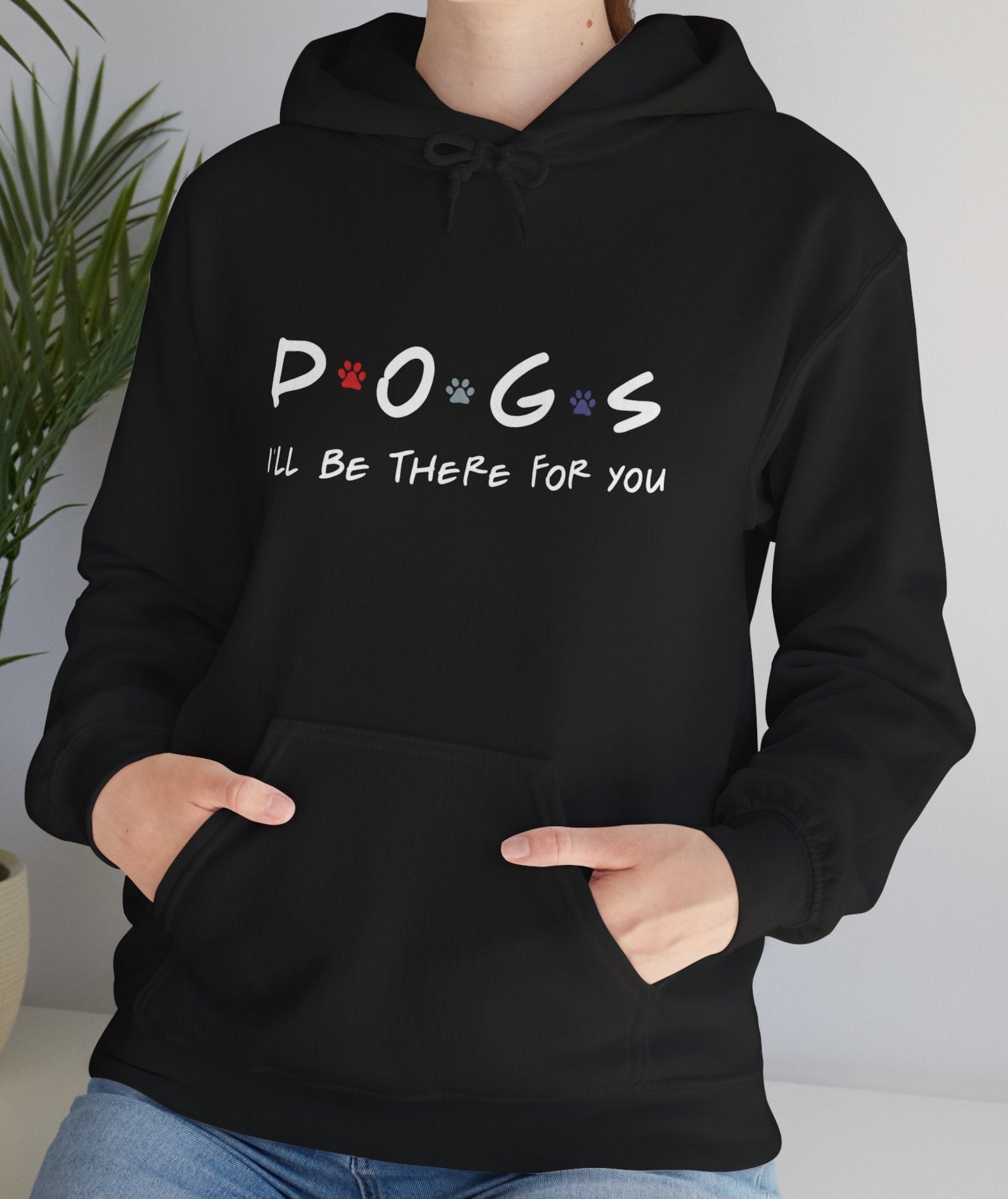 Person wearing a black hoodie with 'DOGS i'll be there for you' text