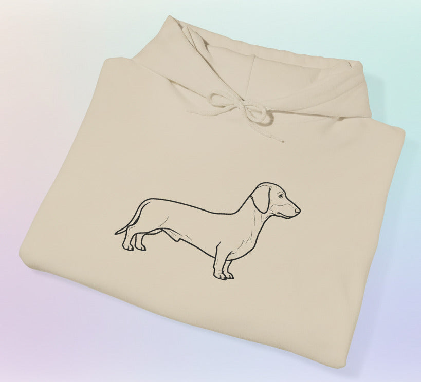 Beige hoodie with a dachshund illustration on a pastel background