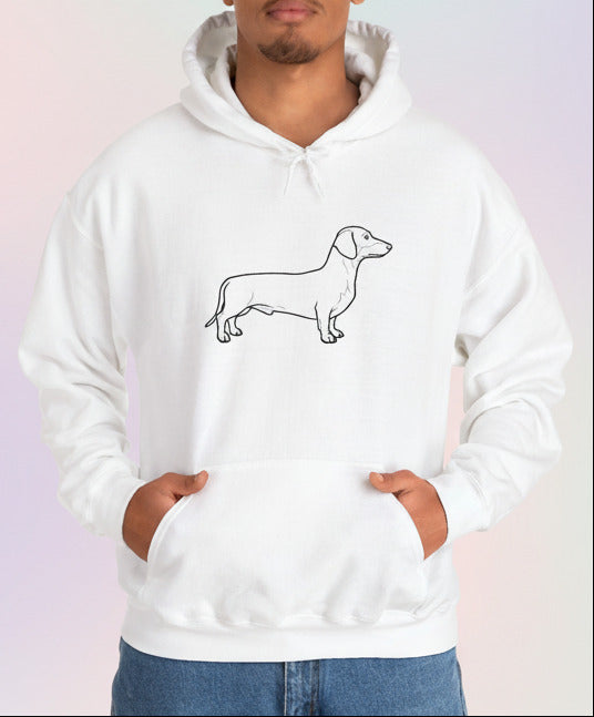 Person wearing a white hoodie with a dachshund graphic on a pastel background
