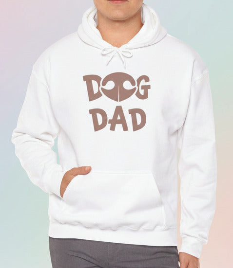 Man wearing a white hoodie with 'Dog Dad' text on a pastel background