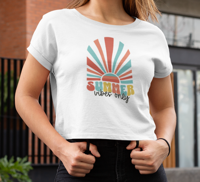 Person wearing a white t-shirt with 'Summer vibes only' design.