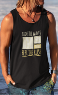 Person wearing a black tank top with text and graphics, standing on a beach.